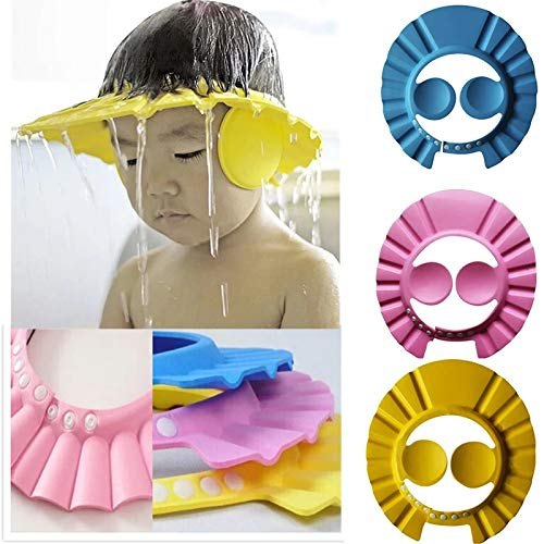 Child using a yellow shower cap with additional colorful shower caps displayed.
