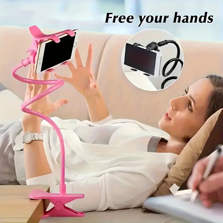 Woman using a pink phone holder with text 'Free your hands' on a blurred background