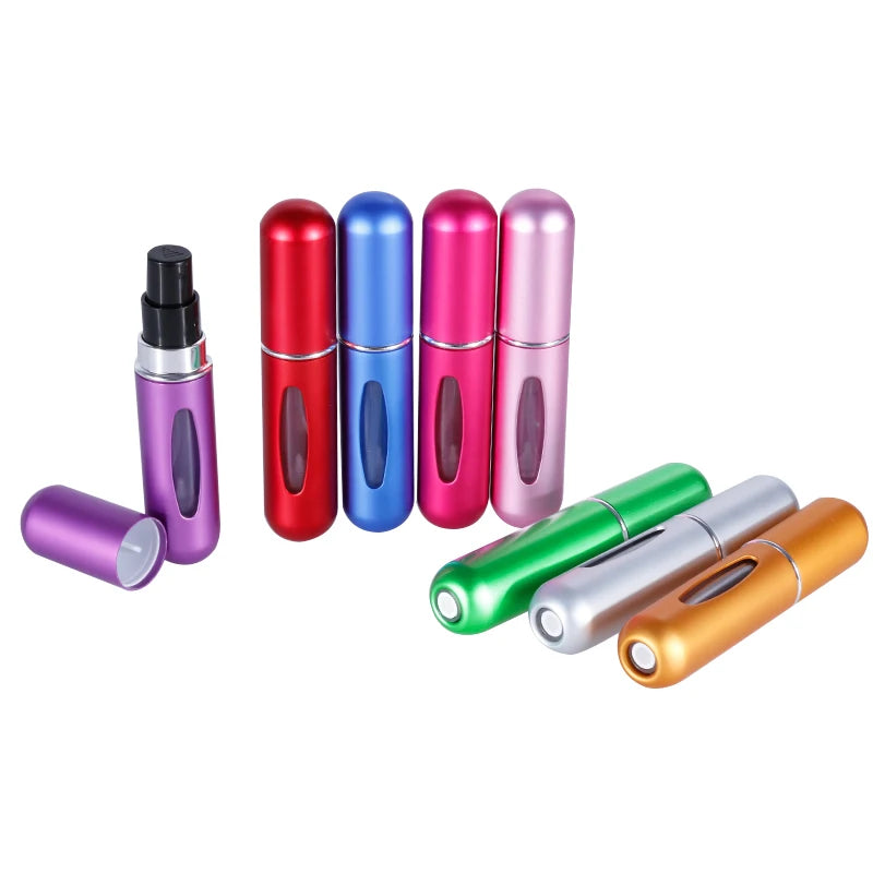 Set of colorful small cylindrical containers on a white background