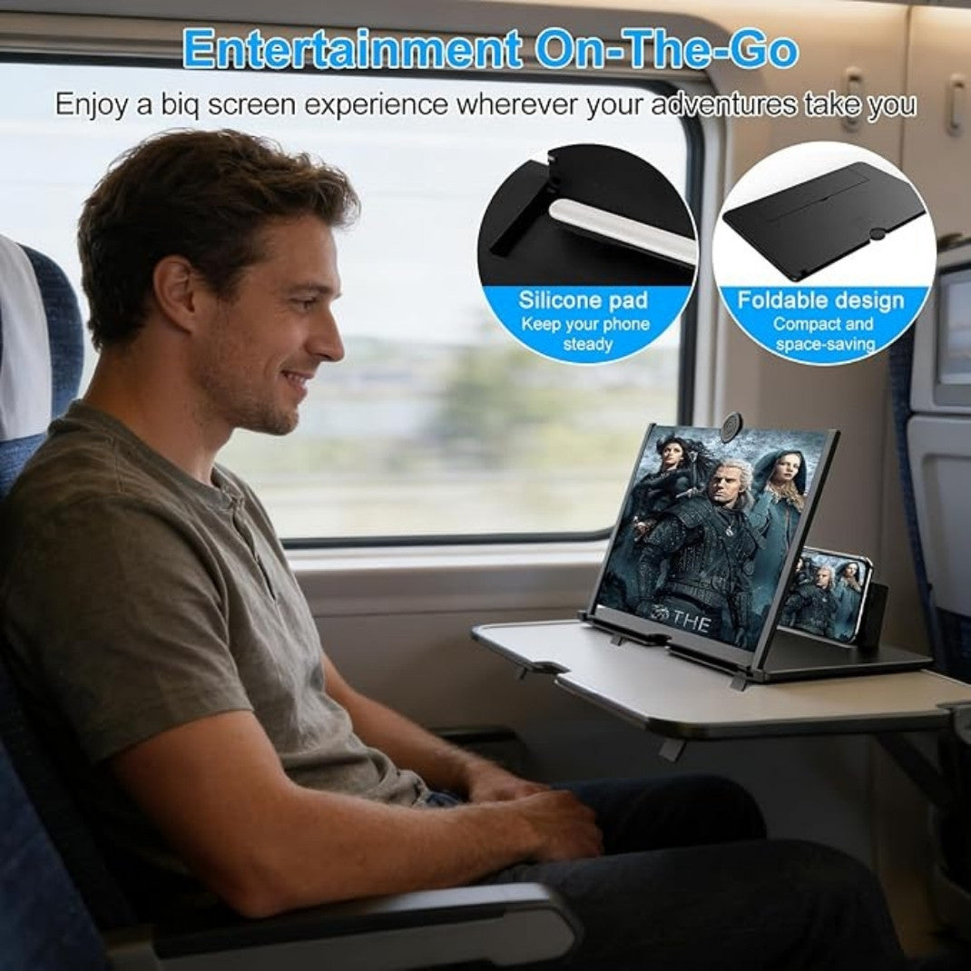 Man sitting on a train using a portable screen with a silicone pad and foldable design.