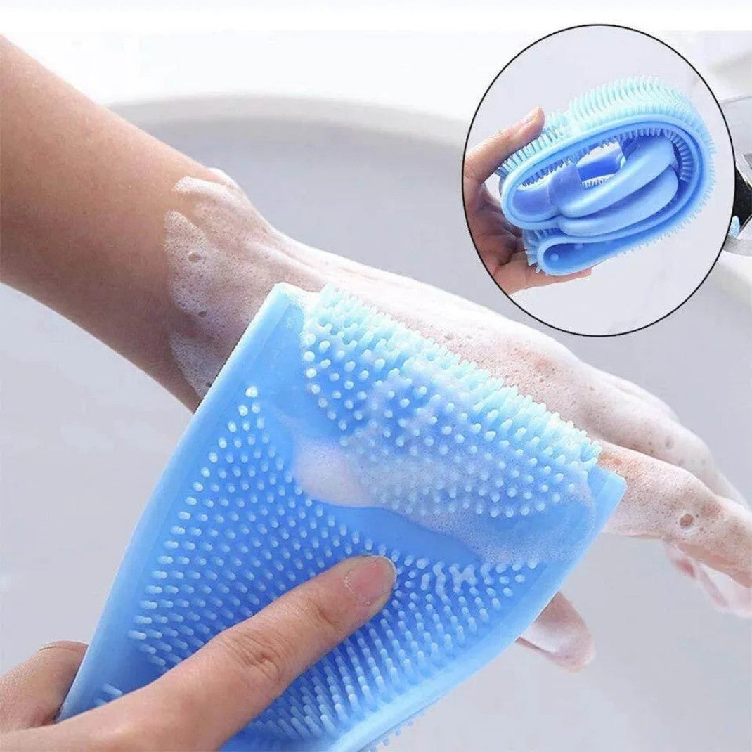 Blue silicone scrubber being used on a hand with soap suds, inset showing close-up of scrubber texture.