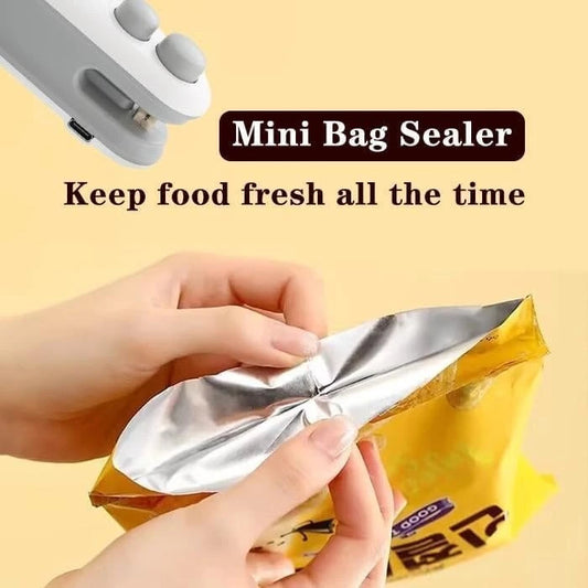 Mini bag sealer being used to seal a yellow bag with text 'Mini Bag Sealer Keep food fresh all the time' on a beige background.
