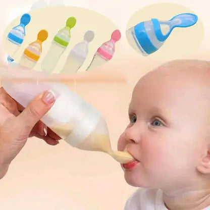 Baby being fed from a bottle with colorful bottles in the background