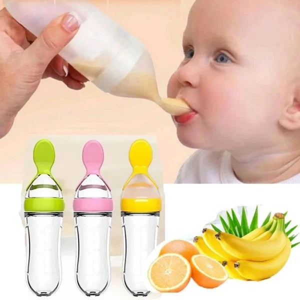 Baby being fed with a bottle and colorful baby bottles with fruits and lemons in the corner.